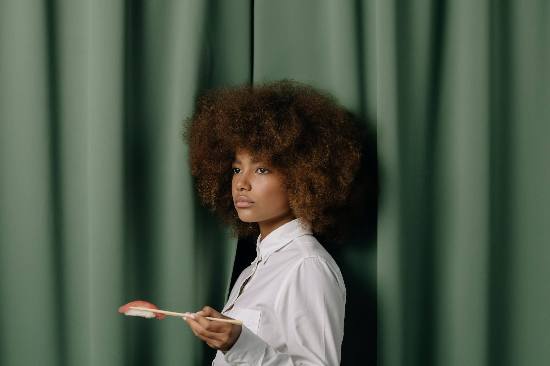 Girl holding sushi